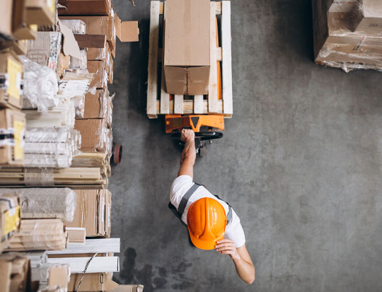 person moving boxes warehouse